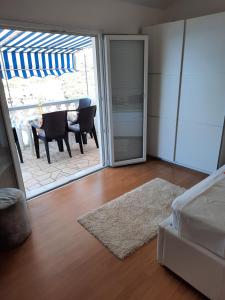 a living room with a sliding glass door to a patio at Apartments Marijana in Zavalatica