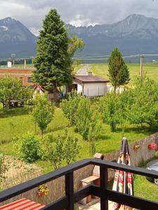 a view from the balcony of a house with mountains at Vysoké Tatry Gerlaška in Svätý Jur