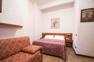 Letto o letti in una camera di Limone Palace Aparthotel