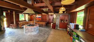 a large room with a kitchen and a dining room at Dukla Ranč in Nižný Komárnik