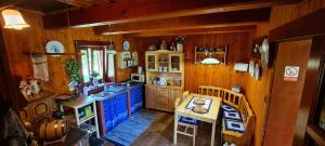 an overhead view of a kitchen with wooden walls at Dukla Ranč in Nižný Komárnik +15 photos