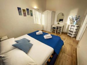 Posteľ alebo postele v izbe v ubytovaní Baglio Reale Apartments