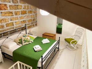 Posteľ alebo postele v izbe v ubytovaní Baglio Reale Apartments