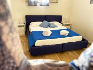 Posteľ alebo postele v izbe v ubytovaní Baglio Reale Apartments