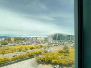 a view of a city with a building and a street at Maison life 小居屋 The Loft Imago in Kota Kinabalu