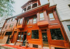 a wooden building on the corner of a street at Acacia Mansion Hotel in Istanbul