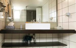 a bathroom with a sink and a mirror at Athens by foot: Perfect flat with terrace in Athens