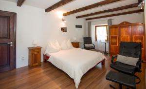 מיטה או מיטות בחדר ב-Alloggi Alla Cantina
