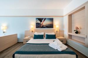 A bed or beds in a room at La Blanche Resort & Spa