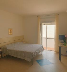 Postel nebo postele na pokoji v ubytování Acquazzura Salento Torre Mozza