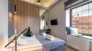 Una cama o camas en una habitación de hvile 119 Gdańsk - prywatne miejsce parkingowe