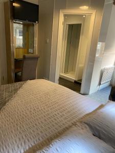 A bed or beds in a room at The Brighton 