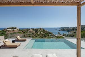 a villa with a pool and a view of the ocean at Luxurious new villa Kokomo Gaia w/ Private Pool, 400m to beach in Lygaria