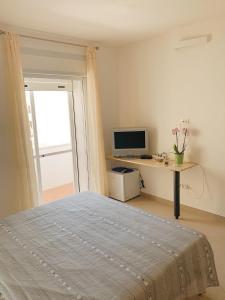 TV a/nebo společenská místnost v ubytování Acquazzura Salento Torre Mozza