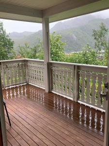 a porch with a view of the mountains at Big house in amazing Napp, Lofoten in Napp
