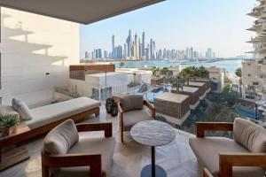 a living room with a view of the city at Fantastic Sea Views on the Palm's hottest Resort in Dubai