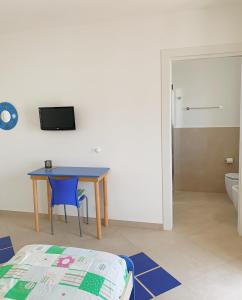 TV a/nebo společenská místnost v ubytování Acquazzura Salento Torre Mozza