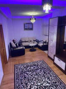 a living room with a couch and a table at Guest House Alea in Ulcinj
