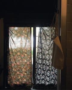 a view of a window with a curtain on it at Jasmine & Tea House in Mae Nam