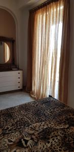 A bed or beds in a room at Vacanze in Sicilia