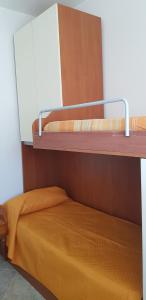 A bed or beds in a room at Vacanze in Sicilia