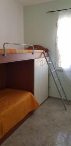 A bed or beds in a room at Vacanze in Sicilia