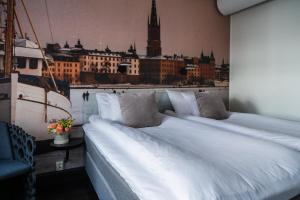 Postel nebo postele na pokoji v ubytování Hotel C Stockholm + 37 fotografií