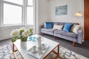 a living room with a couch and a table at Host & Stay - The Gallery Apartments in Scarborough