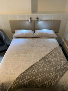 A bed or beds in a room at The Brighton 