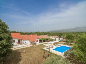 an aerial view of a house with a swimming pool at Villa Vitis ZadarVillas in Oklaj