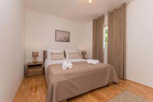 Postel nebo postele na pokoji v ubytování Villa Vitis ZadarVillas + 29 fotografií