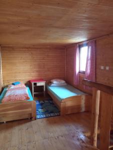 Postel nebo postele na pokoji v ubytování chata FRIDAY