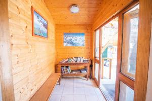 a room with a bench in a wooden wall at cellier 1 in Les Deux Alpes