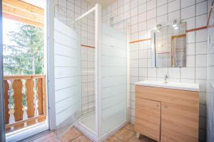 a bathroom with a sink and a mirror at cellier 1 in Les Deux Alpes +16 photos