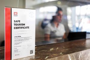 a sign that says safe townhuman centric on a counter at Marina Park Hotel in Istanbul
