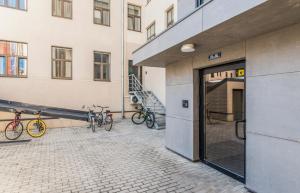two bikes are parked outside of a building at Cozy Modern Studio - Great for Short Trips in Riga