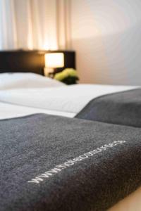 Postel nebo postele na pokoji v ubytování Hotel Concorde