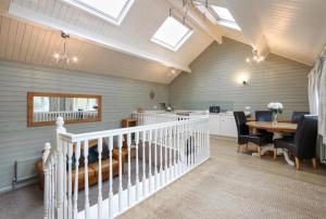 a kitchen and dining room with a table and chairs at River View in Buxton