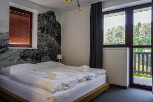 Postel nebo postele na pokoji v ubytování Apartmány Sport & Ski