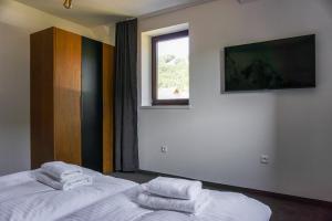 Postel nebo postele na pokoji v ubytování Apartmány Sport & Ski