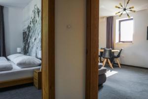 Postel nebo postele na pokoji v ubytování Apartmány Sport & Ski