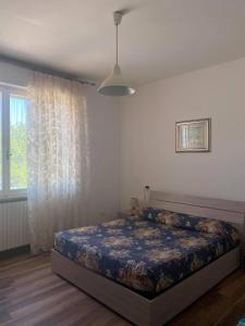 Una cama o camas en una habitación de Casa Vacanze Raggio Di Sole