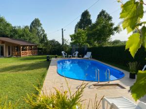 a swimming pool in the backyard of a house at Matyas Vendeghaz in Sovata