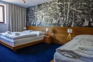 Postel nebo postele na pokoji v ubytování Apartmány Sport & Ski