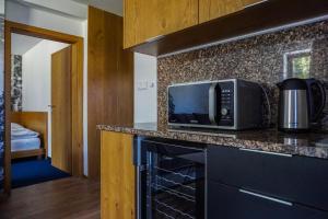 Kuchyň nebo kuchyňský kout v ubytování Apartmány Sport & Ski