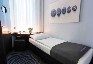 Postel nebo postele na pokoji v ubytování Hotel Concorde