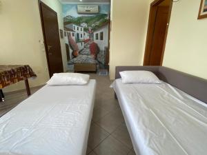 Postel nebo postele na pokoji v ubytování Caryatis Ntoridis Studios & Apartments in Afitos