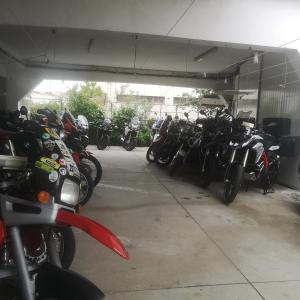 a group of motorcycles parked in a garage at Hotel 4 Estacoes in Chaves