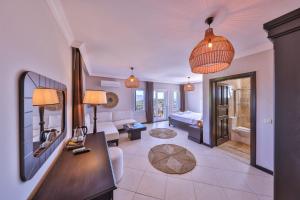 a living room with a couch and a table at Hill House Adult Only in Kaş