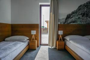 Postel nebo postele na pokoji v ubytování Apartmány Sport & Ski